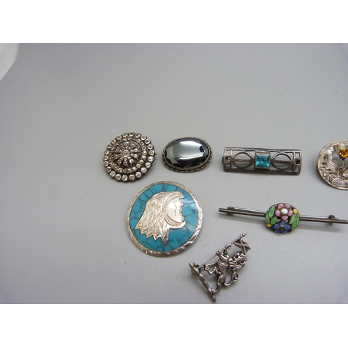 912 - Seven silver brooches and two other brooches