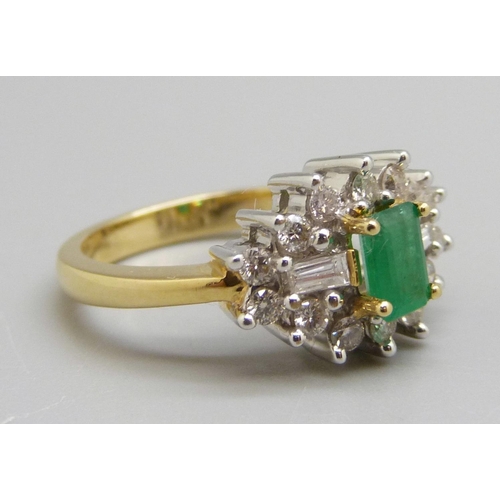 918 - An 18ct gold emerald and diamond cluster ring, M, 6.6g, fourteen brilliant cut diamonds, two baguett... 