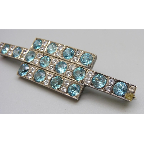 919 - An Art Deco style brooch, thirty white sapphires plus sixteen blue stones, (possibly zircon), 8cm, s... 