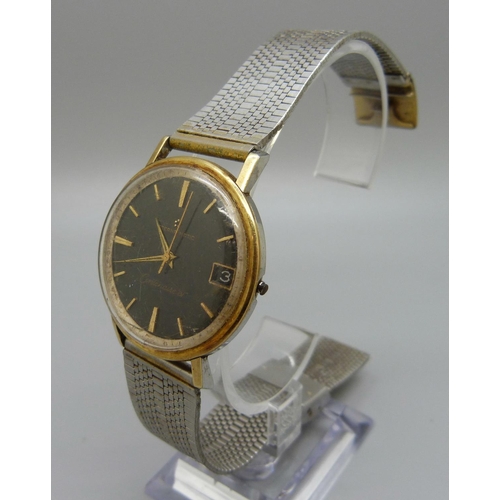 941 - An Eterna-Matic Centernaire '61' wristwatch, black dial with gold baton markers, lacking crown