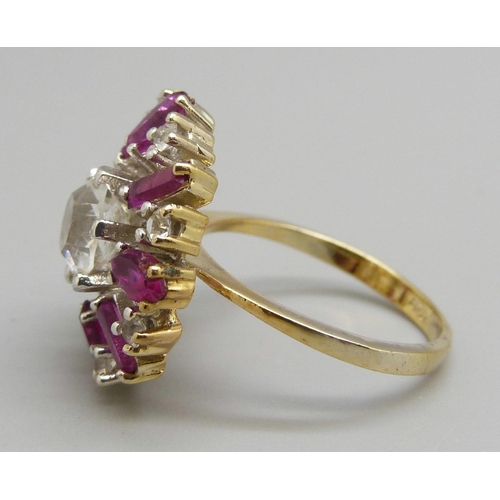 957 - A silver gilt, red and white stone dress ring, O