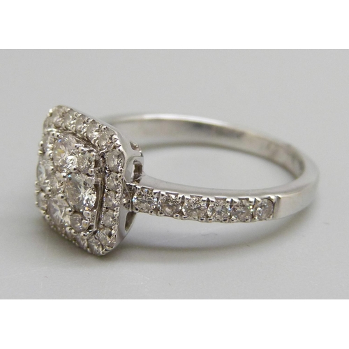 963 - An 18ct gold diamond cluster ring L, 3.8g, over 1ct total diamond weight, mark worn