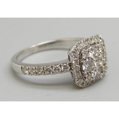 963 - An 18ct gold diamond cluster ring L, 3.8g, over 1ct total diamond weight, mark worn