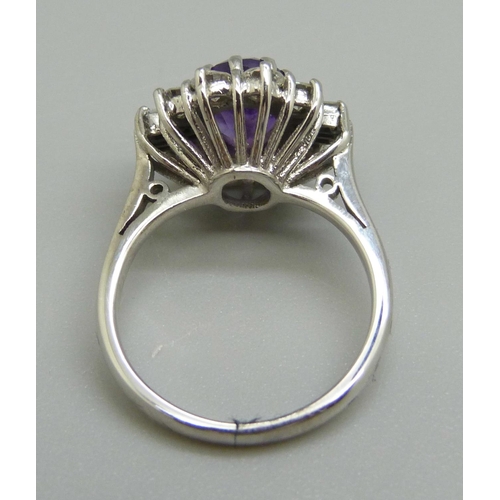 966 - An 18ct white gold, amethyst and diamond cluster ring, J, 4.7g, 1ct diamond weight