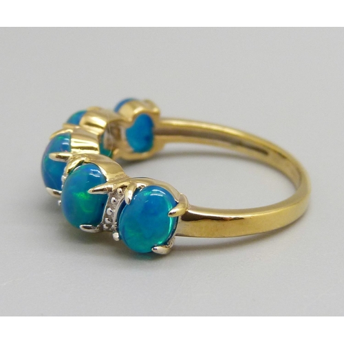 970 - A silver gilt five stone synthetic blue opal ring, N