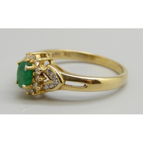 971 - An emerald and diamond cluster ring, 3.1g, O, marked 18ct