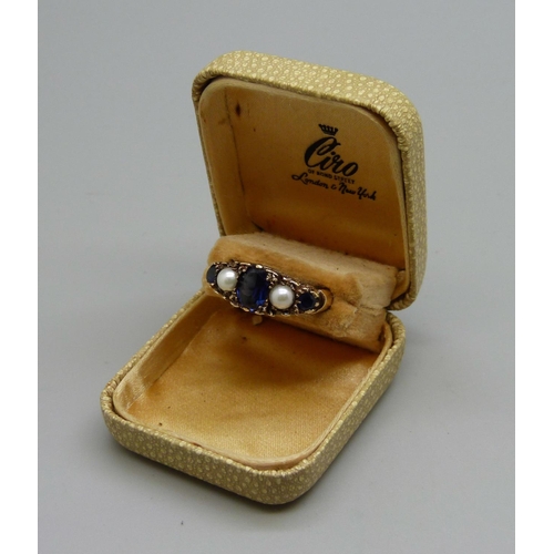 977 - A yellow metal, sapphire and pearl ring, 4.7g, M, marked 9k