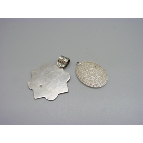 978 - A silver Silver Jubilee oval pendant and a continental white metal pendant, 32g