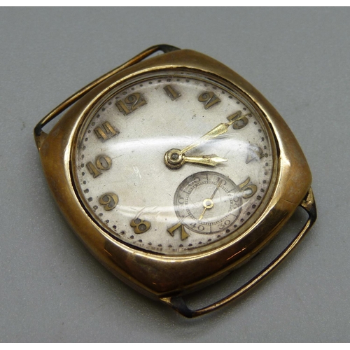 980 - A 9ct gold cased wristwatch head, the movement marked Visible, weight of case back 3.9g, lacking cro... 