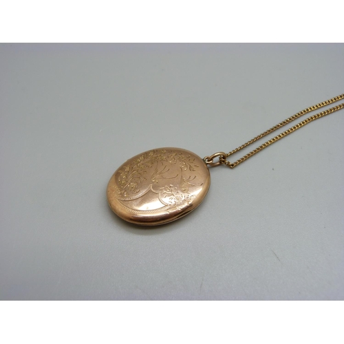 998 - A vintage 9ct gold front and back locket on a 9ct gold chain, chain 3g