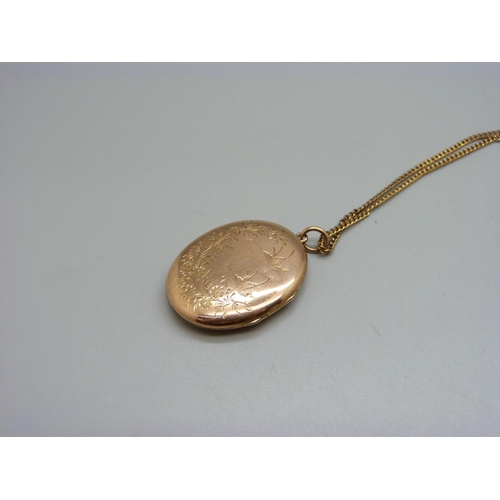 998 - A vintage 9ct gold front and back locket on a 9ct gold chain, chain 3g