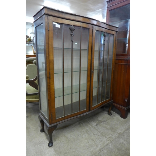 107 - A mahogany serpentine display cabinet