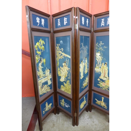 11 - A Chinese mahogany and blue chinoiserie decorated six panel folding screen