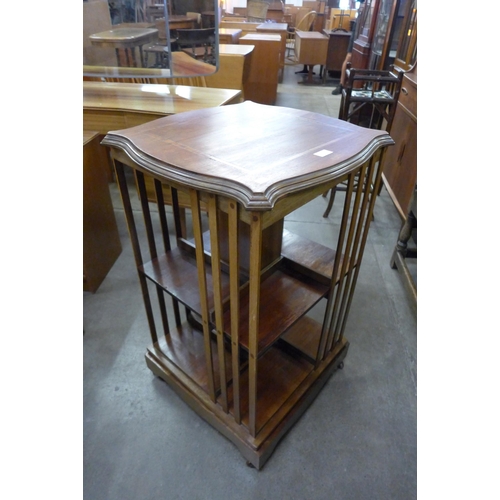 111 - An Edward VII inlaid mahogany revolving bookcase