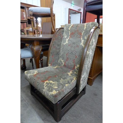 119 - An early 20th century beech and fabric upholstered lambing style chair