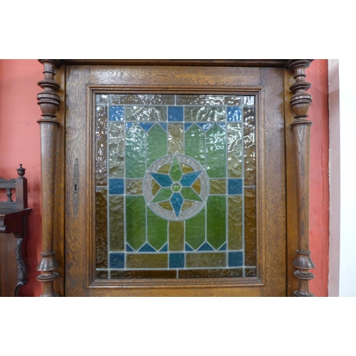 13 - A 19th Century French carved oak and stained glass side cabinet