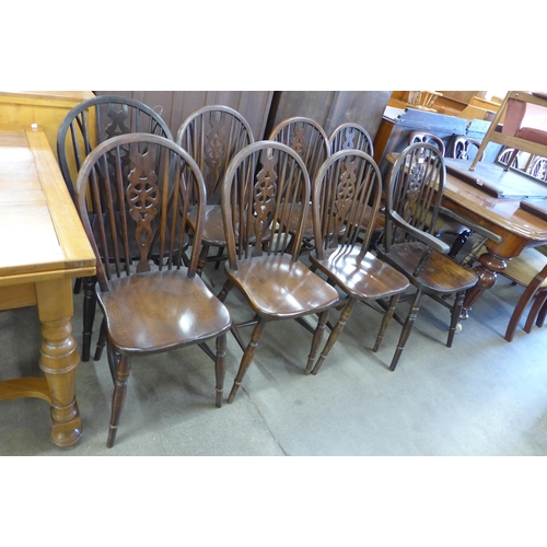 136 - A set of eight elm and beech wheelback chairs