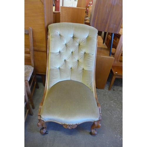 142 - A Victorian carved walnut and green fabric upholstered lady's chair