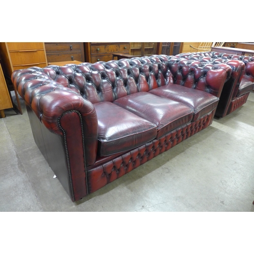 16 - An oxblood leather Chesterfield settee