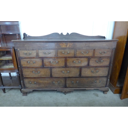 175 - A George II inlaid mahogany fourteen drawer Lancashire chest