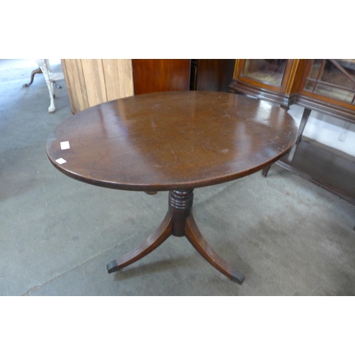 177 - A George IV mahogany oval tilt-top tripod table