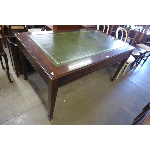 194 - A mahogany and green leather topped library table