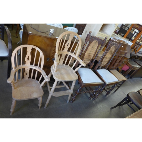 196 - A pair of oak barleytwist chairs, an Arts and Crafts inlaid oak chair and two child's beech chairs