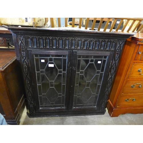 203 - A Victorian carved oak wall hanging corner cabinet