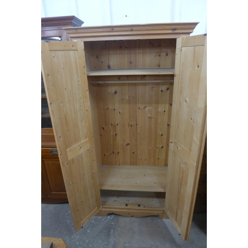 219 - A pine two door wardrobe