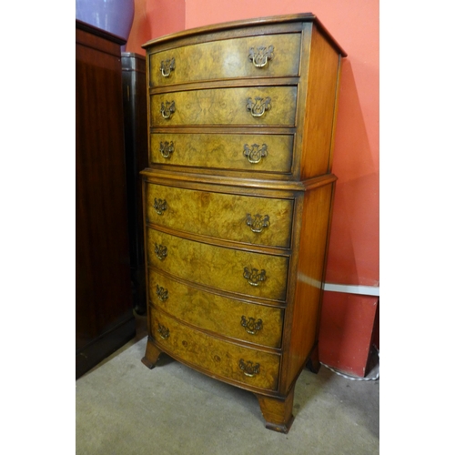 26 - A George III style burr walnut chest of drawers