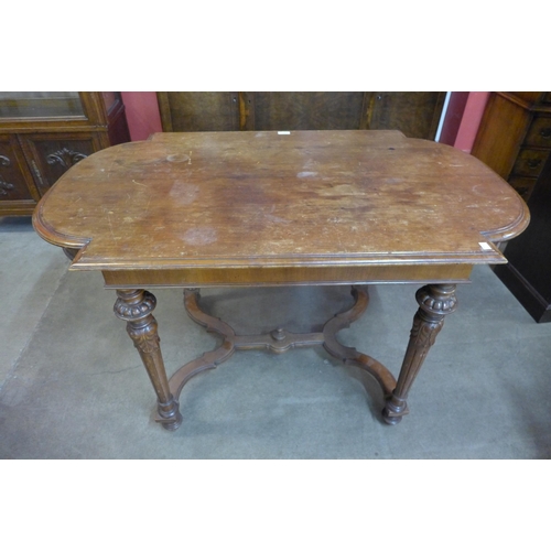 28 - A19th Century French walnut bow end library table