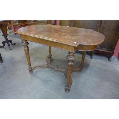 28 - A19th Century French walnut bow end library table