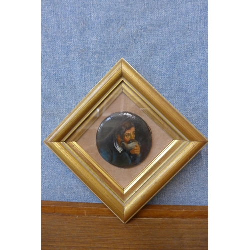 290 - A German School portrait miniature of a gentleman, oil on paper mache, framed