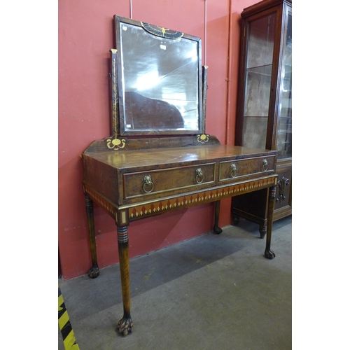 30 - An Art Deco Egyptian Revival walnut and painted leather dressing table, manner of Carlo Bugatti