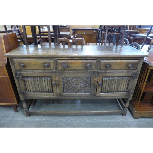 32 - An Elizabethan Revival carved oak dresser