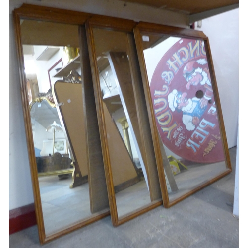 346 - A set of three oak framed mirrors