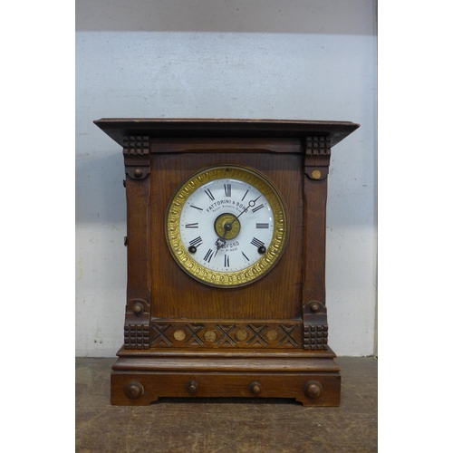 357 - A Victorian oak Fattorini & Sons oak mantel clock