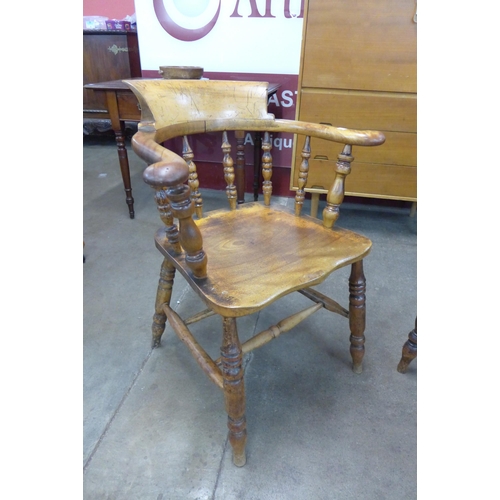 4 - A pair of similar Victorian fruitwood and mahogany smokers bow chairs