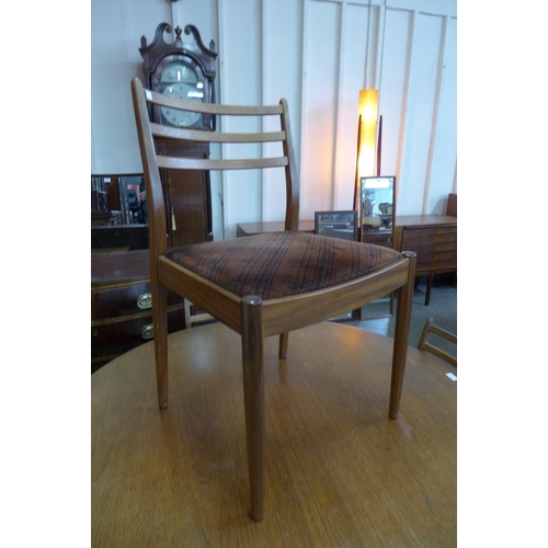 43 - A G-Plan Fresco teak extending dining table and four chairs