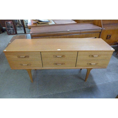 45 - An Austin Suite teak six draw sideboard