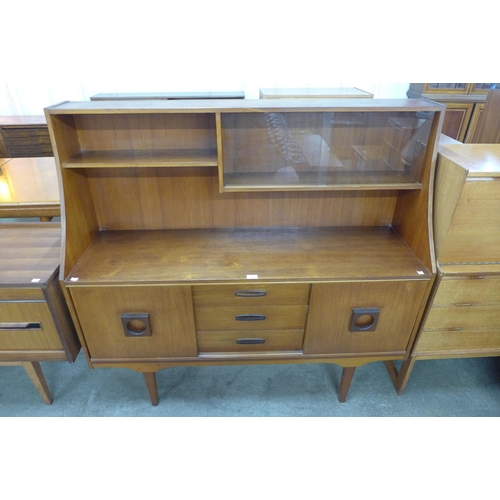 47 - A teak highboard