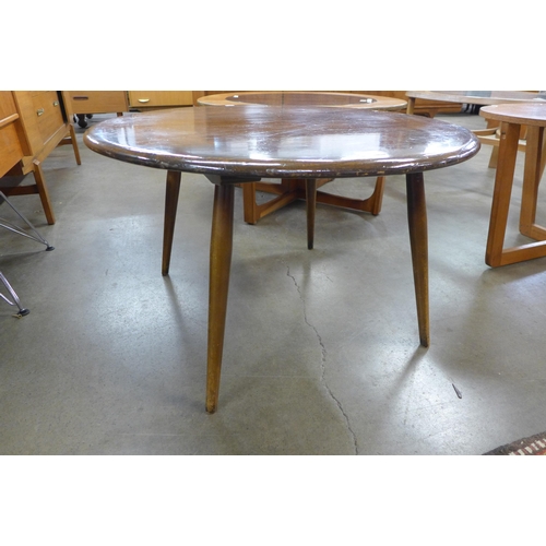 54 - A Ercol Golden Dawn elm and beech circular coffee table