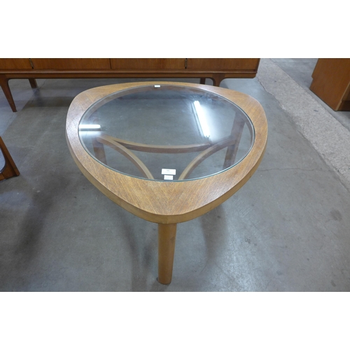 56 - A Nathan teak and glass topped triangular coffee table