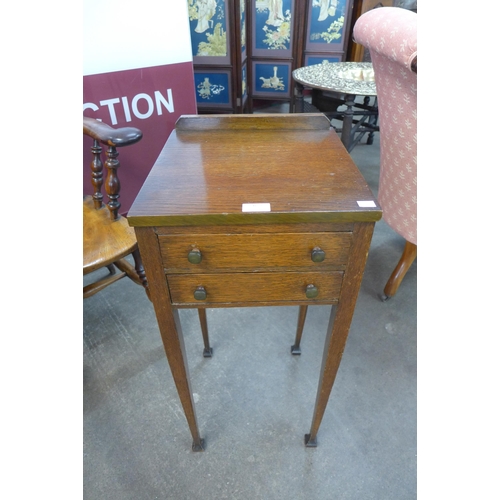 6 - An Art Deco Heals style oak two drawer night stand