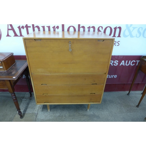 60 - A Hille beech and cherrywood Hilleplan unit J writing cabinet, designed by Robin Day