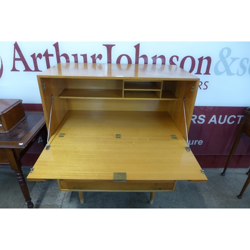 60 - A Hille beech and cherrywood Hilleplan unit J writing cabinet, designed by Robin Day