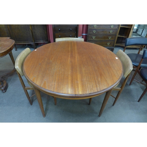 65 - A G-Plan Fresco extending dining table and four chairs