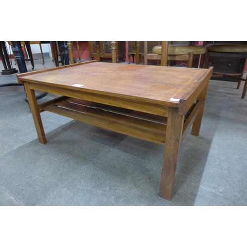 66 - A teak coffee table