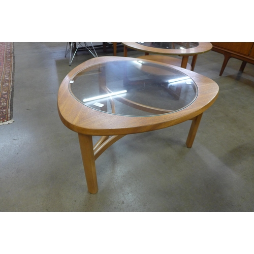 67A - A Nathan teak and glass topped triangular coffee table