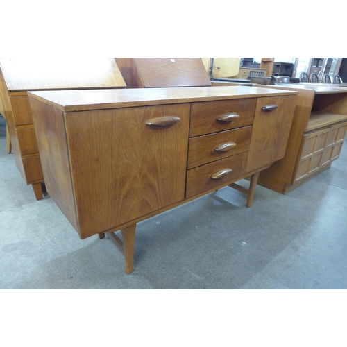 71 - A small teak sideboard